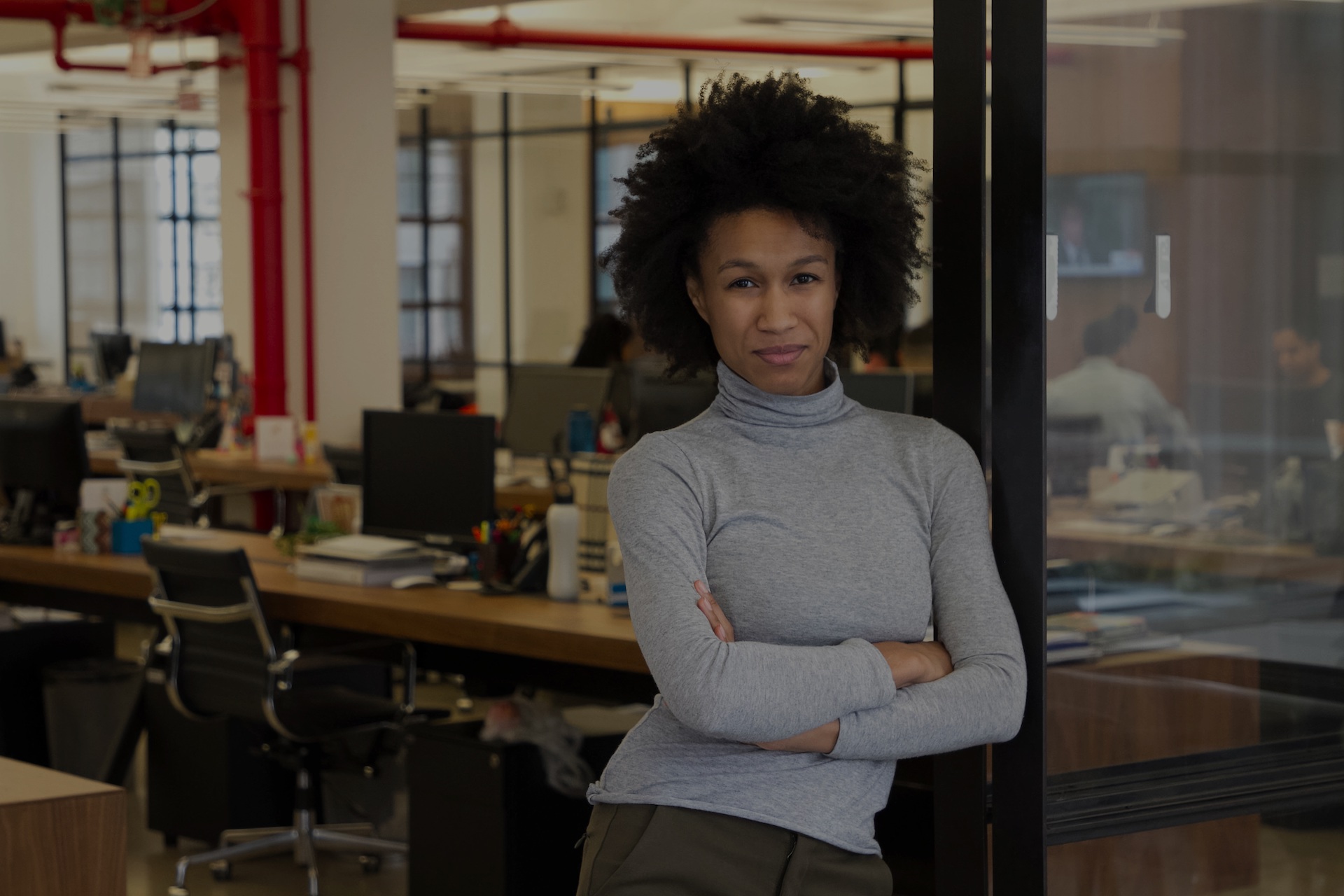 women stood in doorway to her office