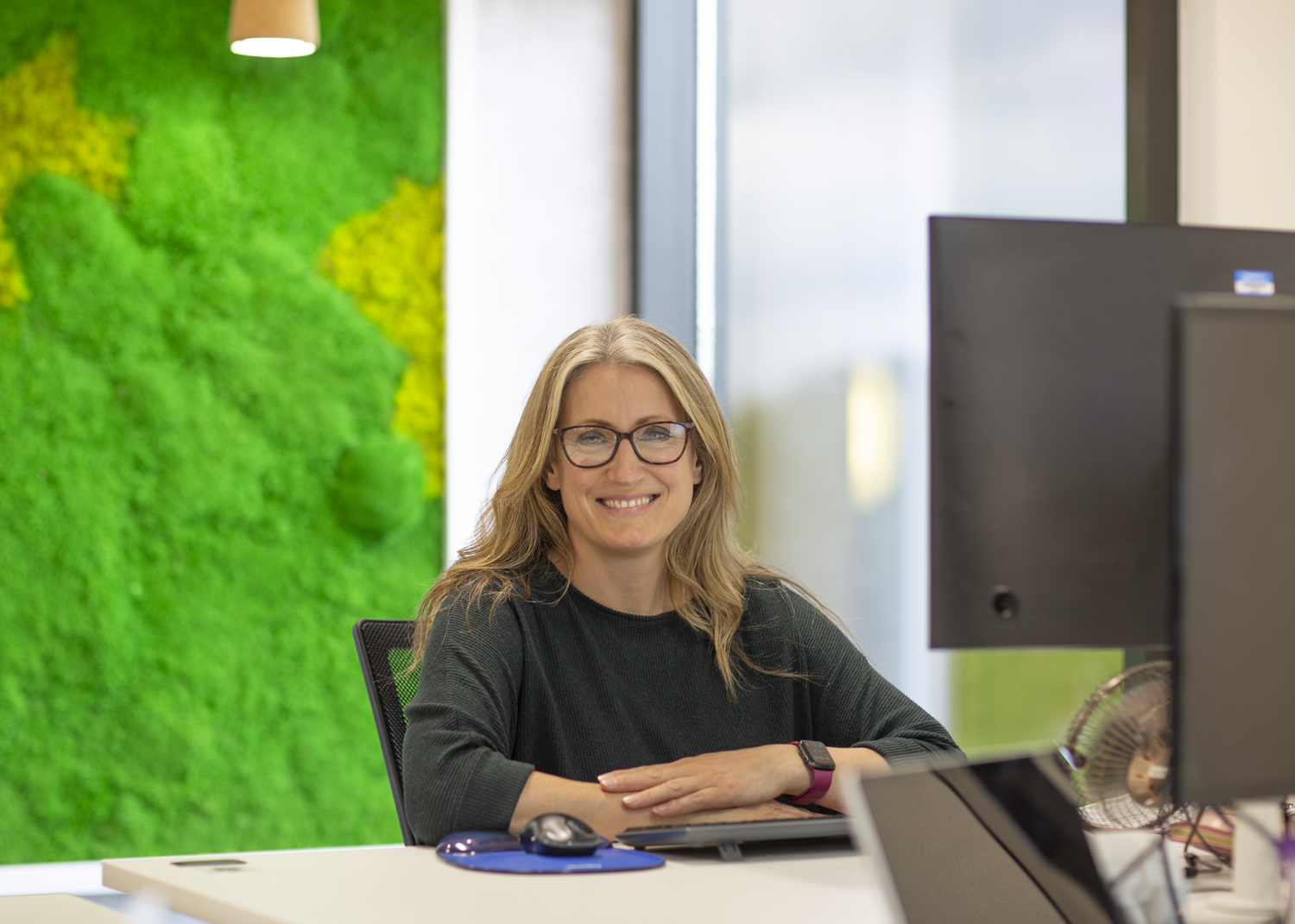 emw team member sat working at desk