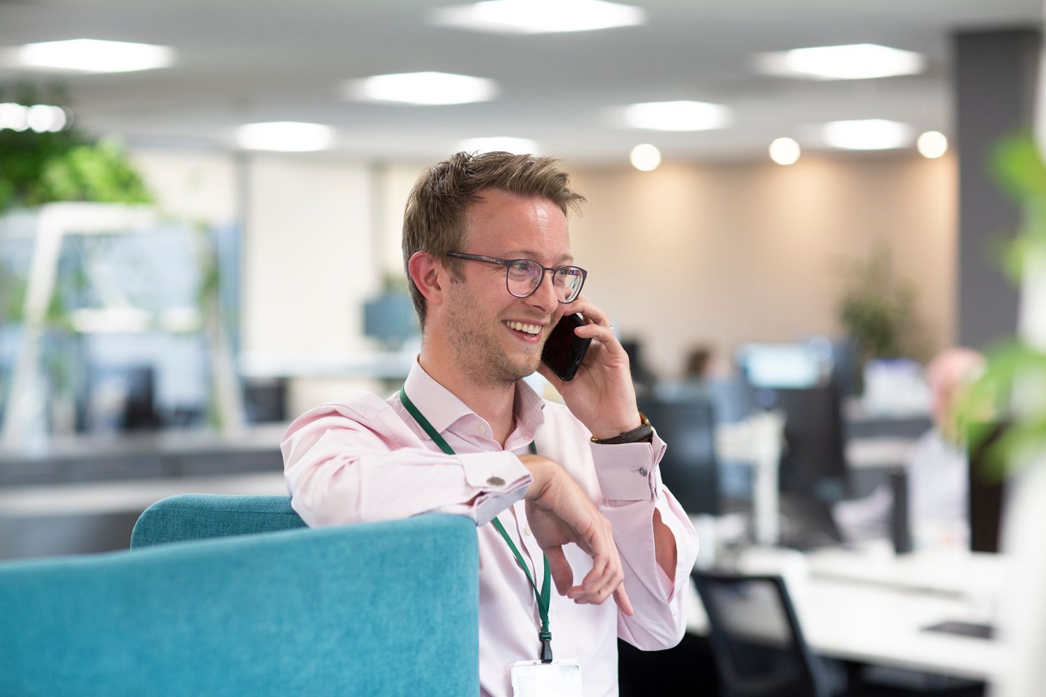 Sean Halliwell smiling while on the phone