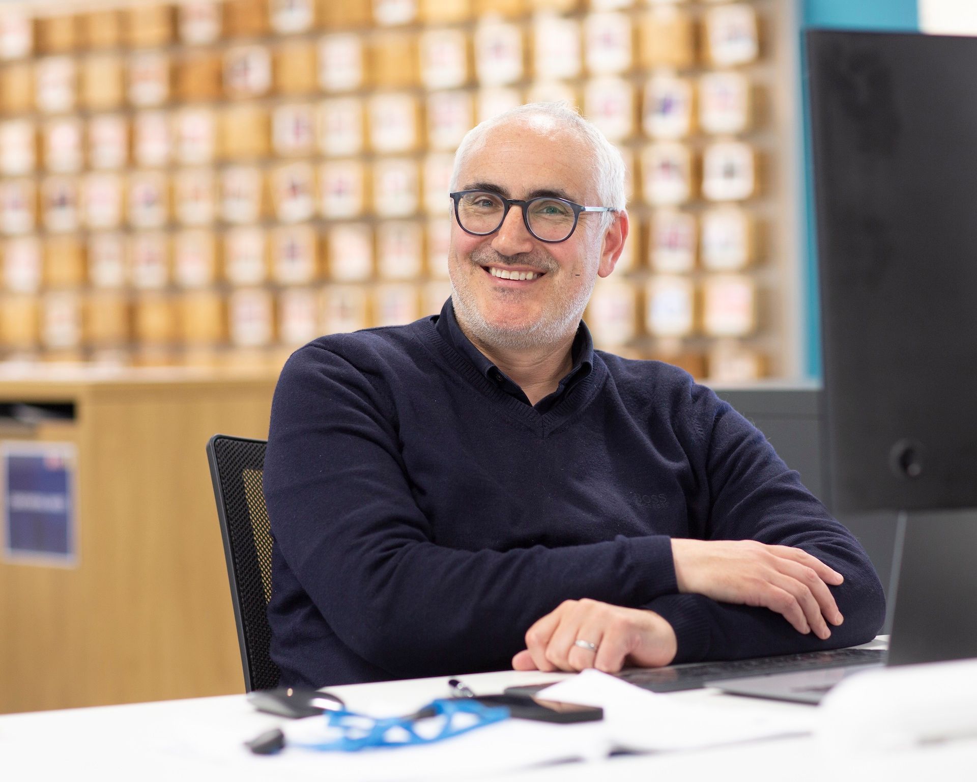 Terence Ritchie smiling while sat at a desk