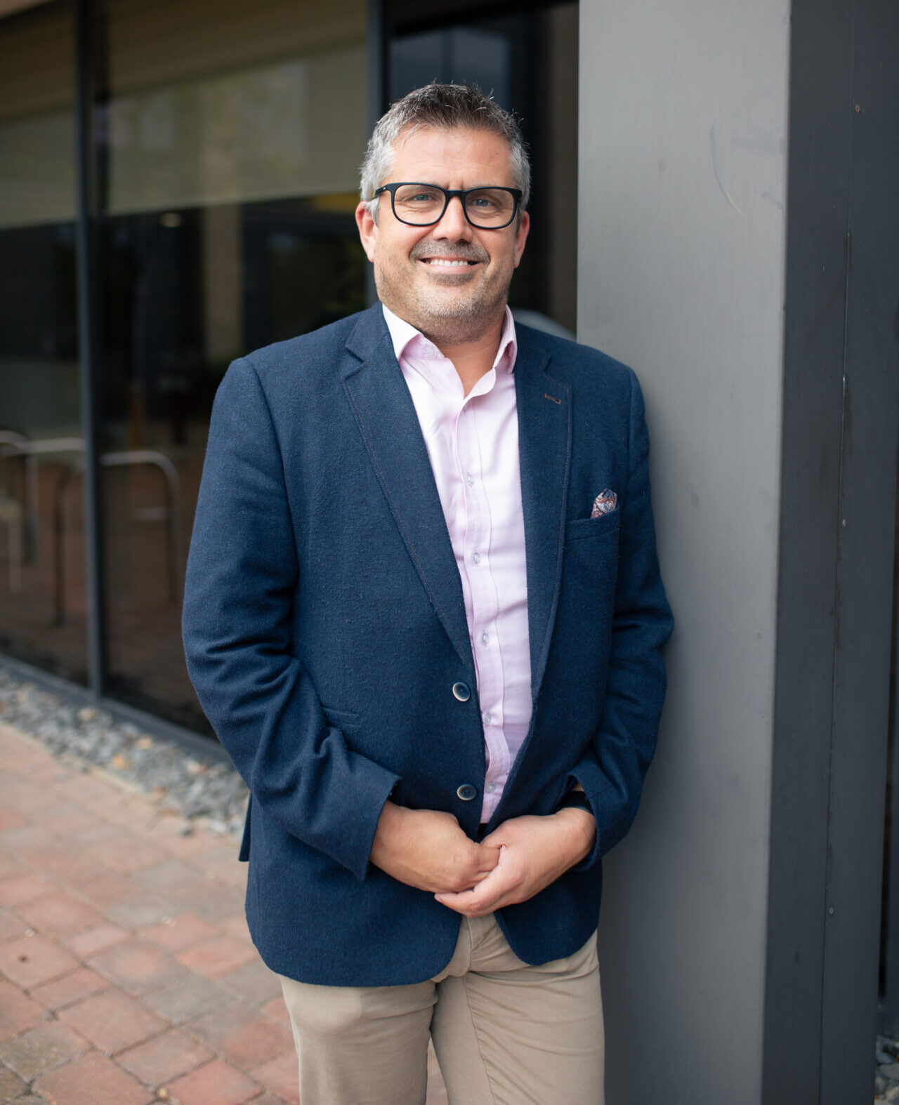 james geary managing partner at emw outside milton keynes office waiting for solicitors and legal team